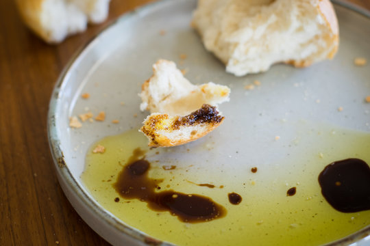 Closeup of Classic Italian Starter: Fresh Crusty White Bread, Extra Virgin Olive Oil and Aged Balsamic Vinegar