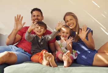 Couple with kids on patio having fun