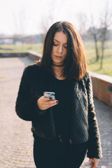 young beautiful woman using smartphone