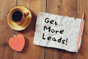 top view image of coffee cup, heart shape and paper