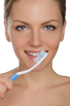 charming woman with toothbrush in mouth