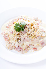 Pasta carbonara with bacon on white background