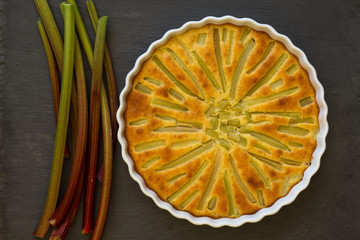 Rhubarb Cake With Stems in White Backing Tray on Slate Backgroun