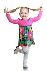 Portrait of a cute little blonde with long tails