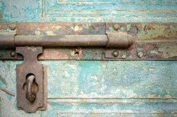 Old window bolt. Outdoor view / Close up 