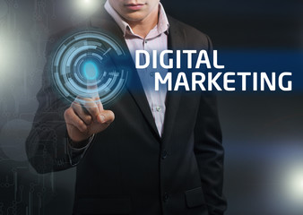 Businessman presses button digital marketing on virtual screens.