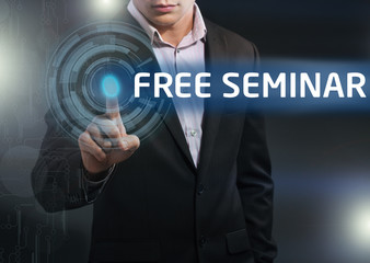 Businessman presses button free seminar on virtual screens. Busi