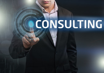 Businessman presses button consulting on virtual screens. Busine