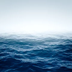 Badkamer foto achterwand Oceaan golf Blauwe oceaan met golven en helderblauwe lucht