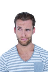 Obraz premium Handsome casual man grimacing in front of camera 