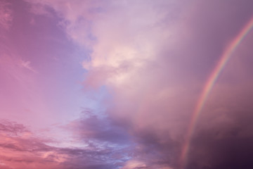 Fototapeta premium rainbow with cloudy on sky,purple color filter effect