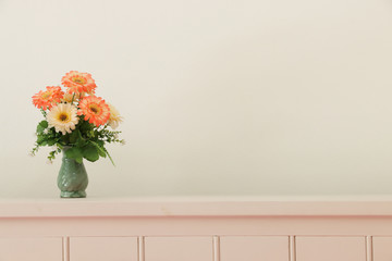 Flower bouquet on headboard.