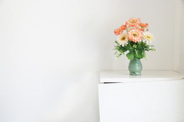 Flower bouquet on white table.