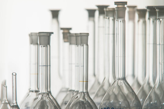 Close up of many transparent glass beakers