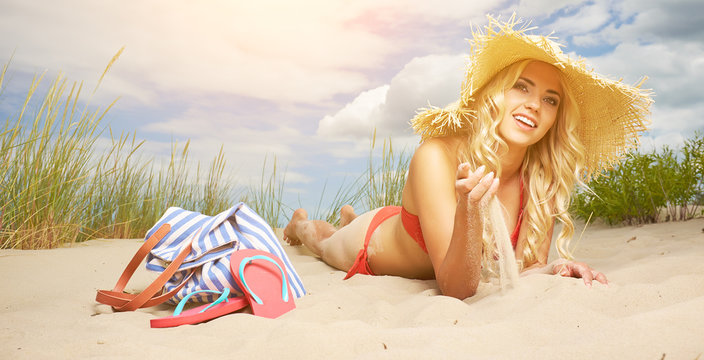 Sexy blonde girl on the summer beach