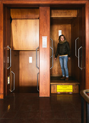 Woman in paternoster elevator