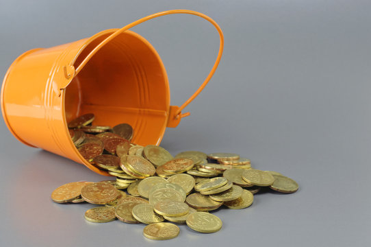 Gold Coins and Bucket - Business Concept