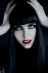 Gorgeous brunette with dark makeup and white skin