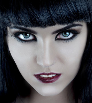 Gorgeous brunette with dark makeup and white skin