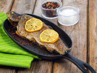 Delicious baked rainbow trout with lemon straight from the oven