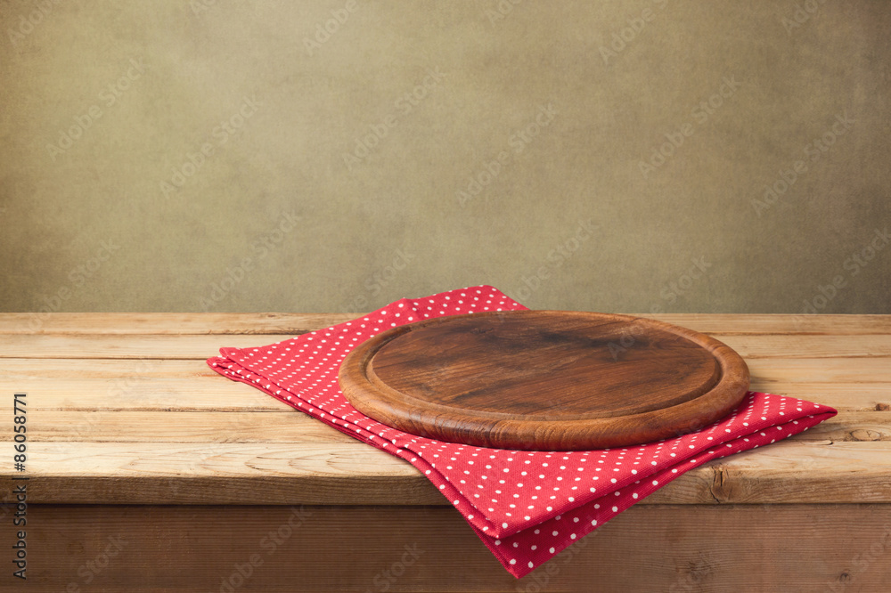 Wall mural background for product montage. round wooden board with tablecloth.