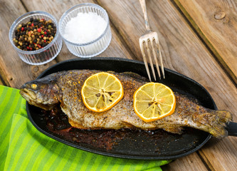 Delicious baked rainbow trout with lemon straight from the oven