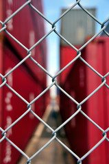 Fototapeta premium Wire mesh fence enclosing the container yard