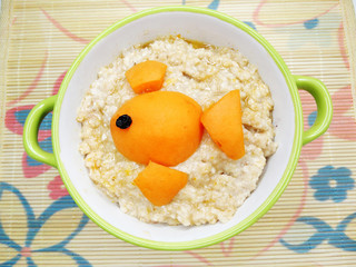 oatmeal porridge creative healthy food for child with fruit