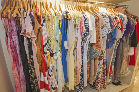 Womens summer clothes hanging on rail