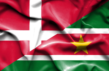 Waving flag of Suriname and Denmark