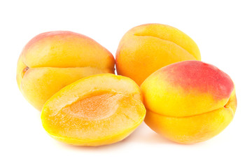 Ripe apricots on white.