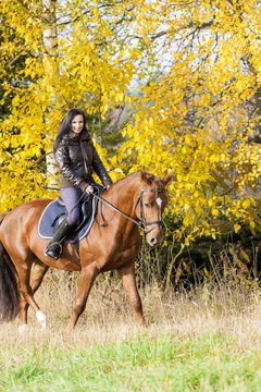 equestrian on horseback in autumnal nature