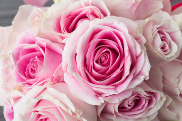 white and pink rose bouquet on wood background