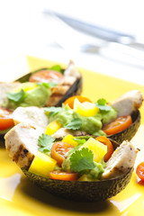 avocado filled with chicken salad and avocado dip