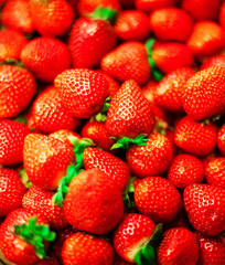 Strawberry  background on a market stall close-up. Food healthy