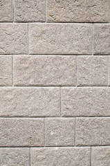 Decorative relief cladding slabs imitating stones on wall