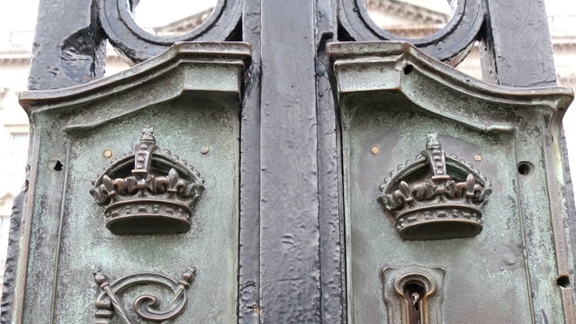 A keyhole on the steel gate of a building in London. The gate is black in color