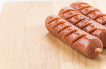 grill sausage on wood board