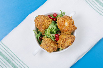 Fried chicken on blue table,