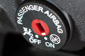 Passenger airbag on/off lock