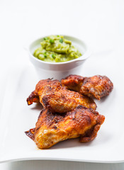 Grilled chicken wings with guacamole