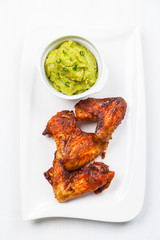 Grilled chicken wings with guacamole