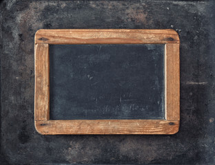 Antique chalkboard on metal texture. Rustic background. Vintage