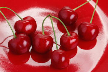 Cherry on a Red Dish
