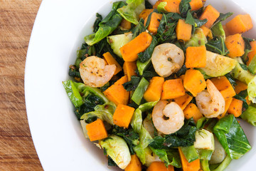 Sweet potato casserole with greens and shrimps