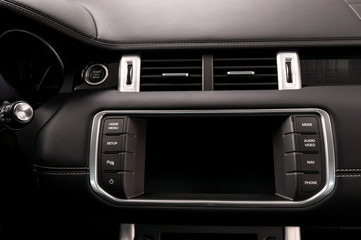 Obraz na płótnie Canvas Modern car dashboard. Multimedia screen. Interior detail.