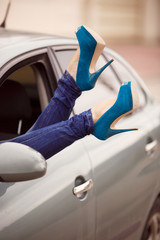 woman legs in shoes glamour girl in car