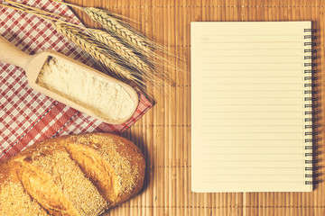 Fototapeta na wymiar Bakery foods and notebook