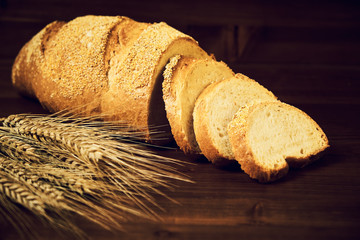 Bread and wheat on the table