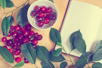 sweet cherry and notebook for daily records